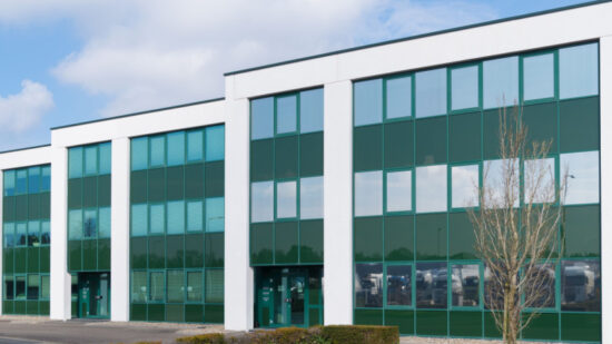 exterior of a modern green office building in the Netherlands-Shutterstock_1673437588